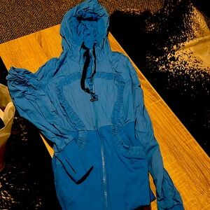 Lululemon reversible turquoise jacket. With pockets, thumb holes and hood